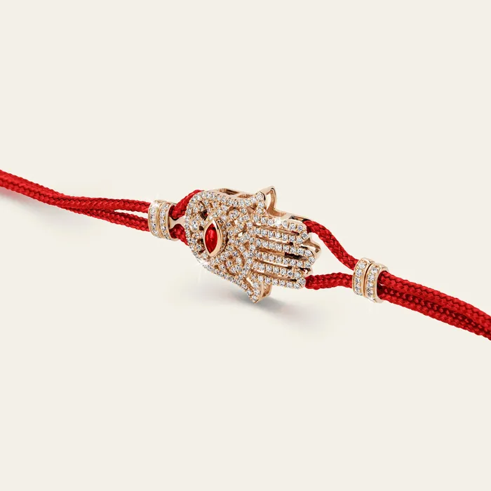 Hand crafted in 18k rose gold and set with 166 highquality round brilliant cut white diamonds and marquise ruby Bracelets Hamsa Diamond Bracelet